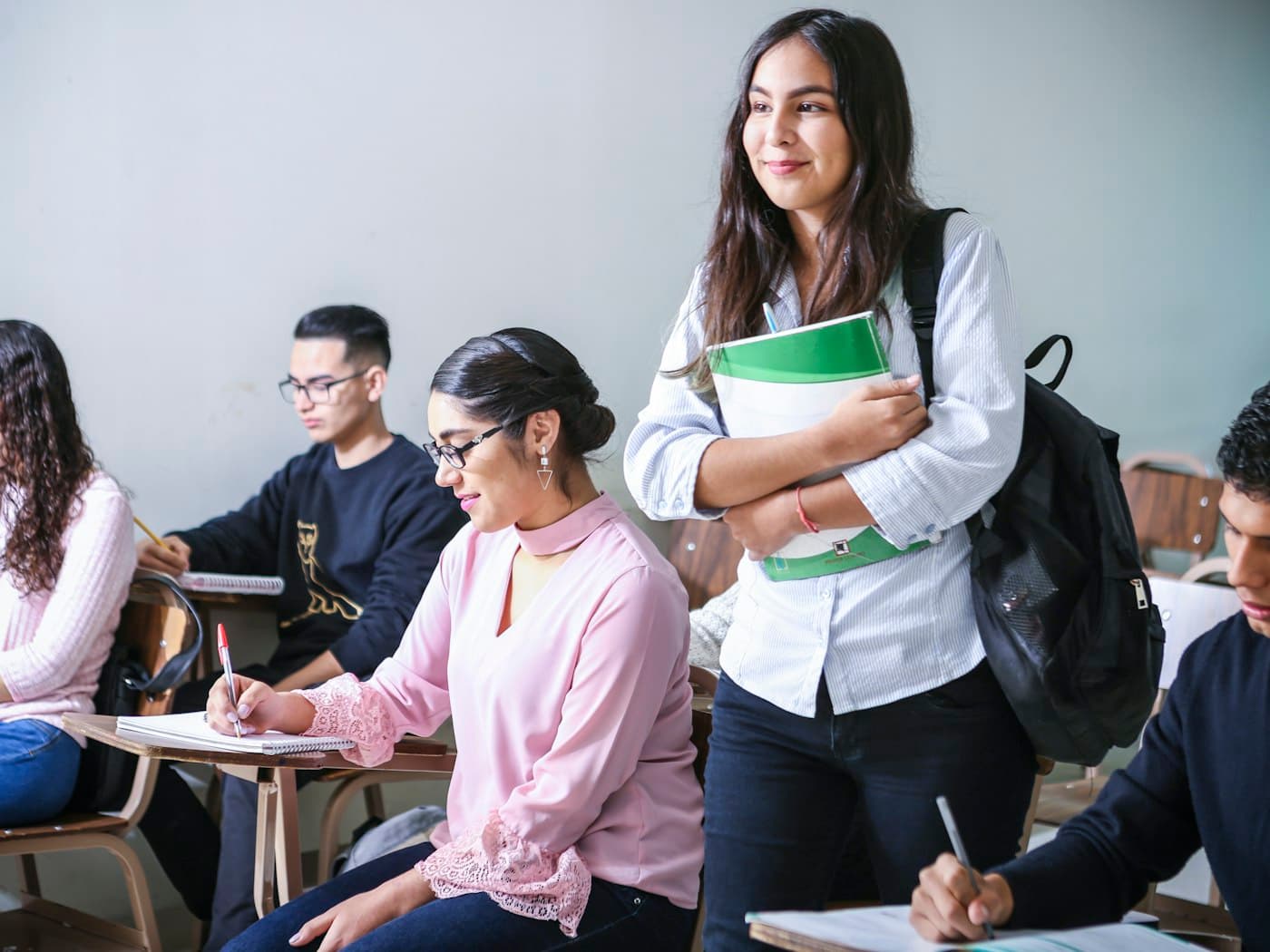 Students working through past-paper questions in a classroom